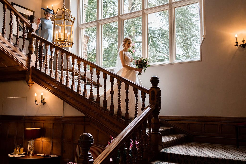bride wlask down the stairs at Hartsfield Manor