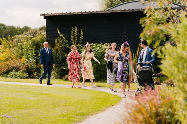 wedding guests arriving at Stokes Farm Barn